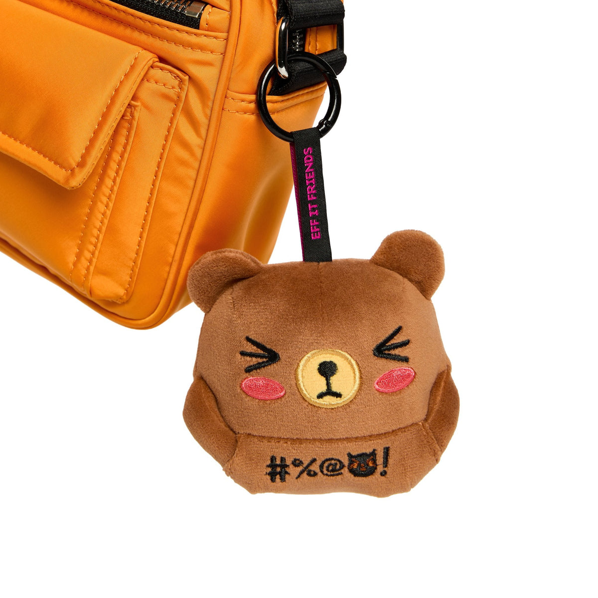 Bernard keychain plush clipped to an orange bag