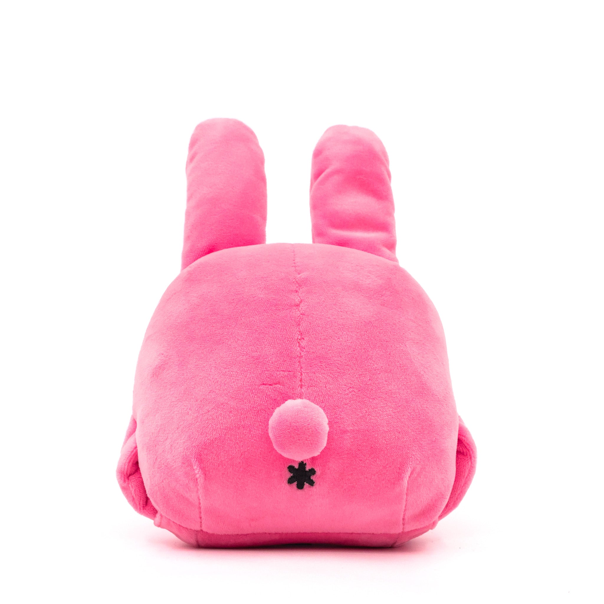 Pink bunny plush, face down, showing its tail and butthole, rear view.