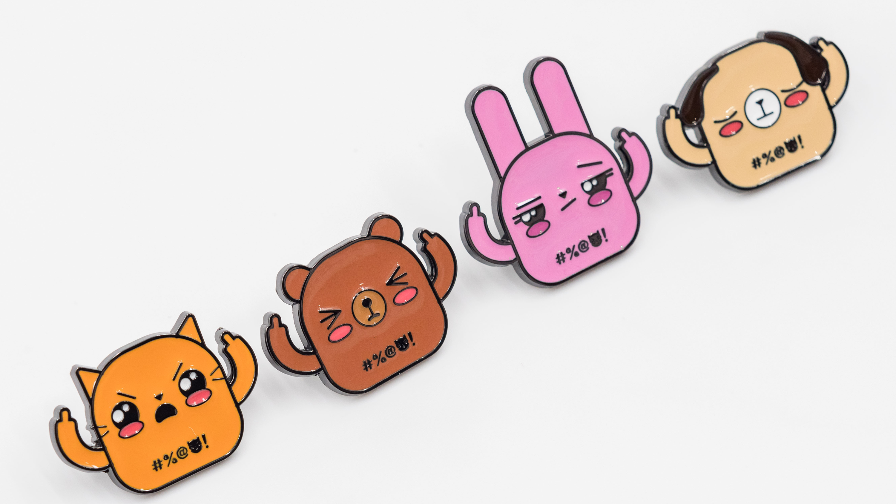 Orange cat enamel pin, brown bear enamel pin, pink bunny enamel pin, beige dog enamel pin, front view on white background