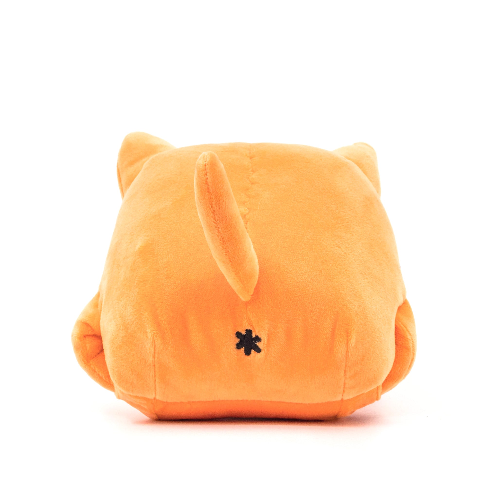 Orange cat plush, face down, showing tail and butthole, rear view.