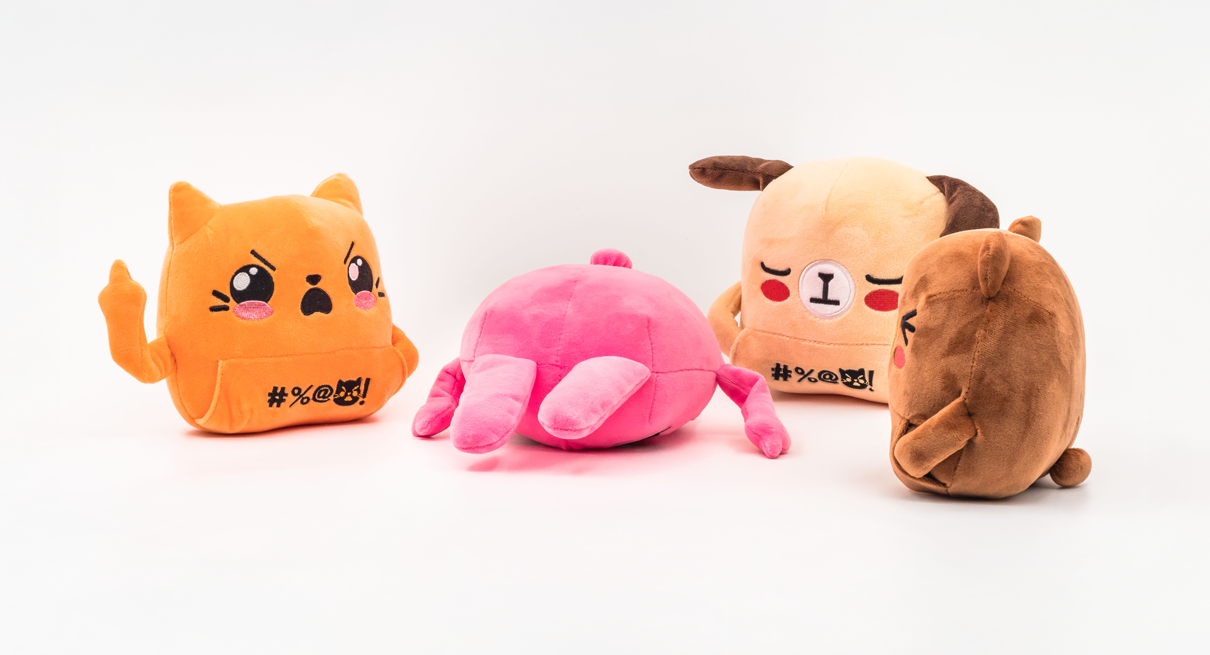 Orange cat, pink bunny, beige dog, brown bear plush toys