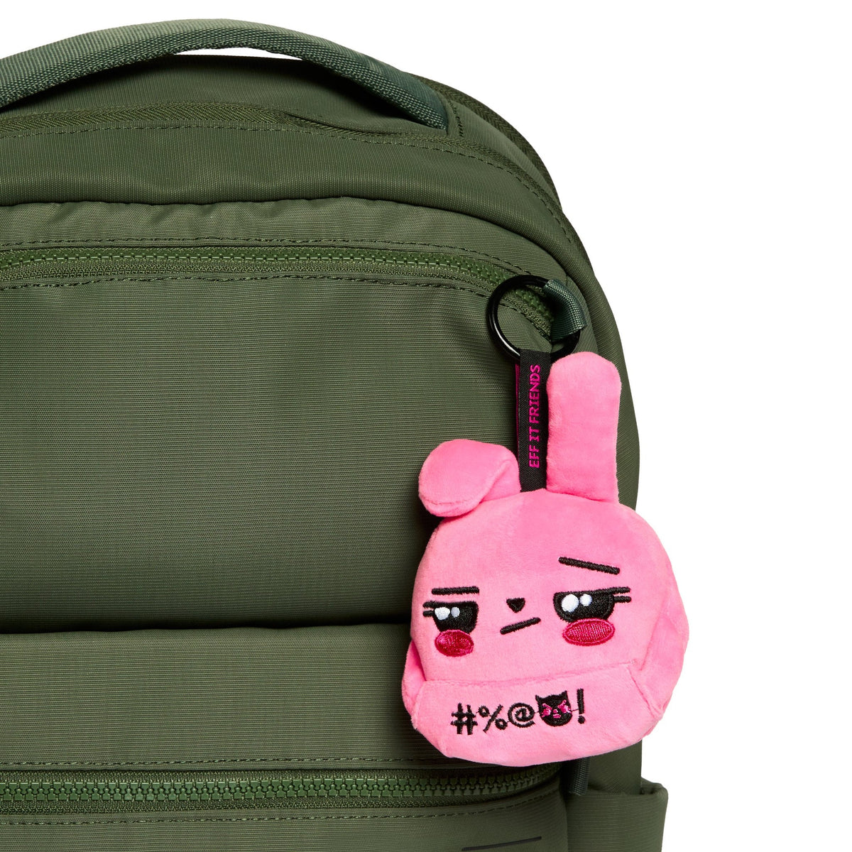 Audra keychain plush clipped to a green backpack