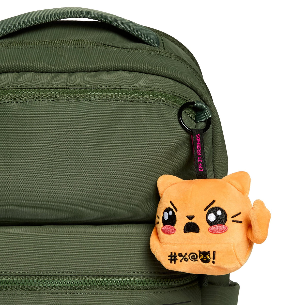 Jackie keychain plush clipped to a green backpack