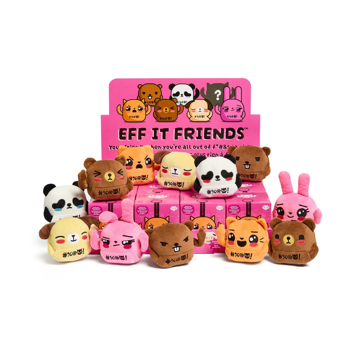 Twelve Eff It Friends keychain plush, commons and uncommons, gathered around a counter display of sealed blind boxes