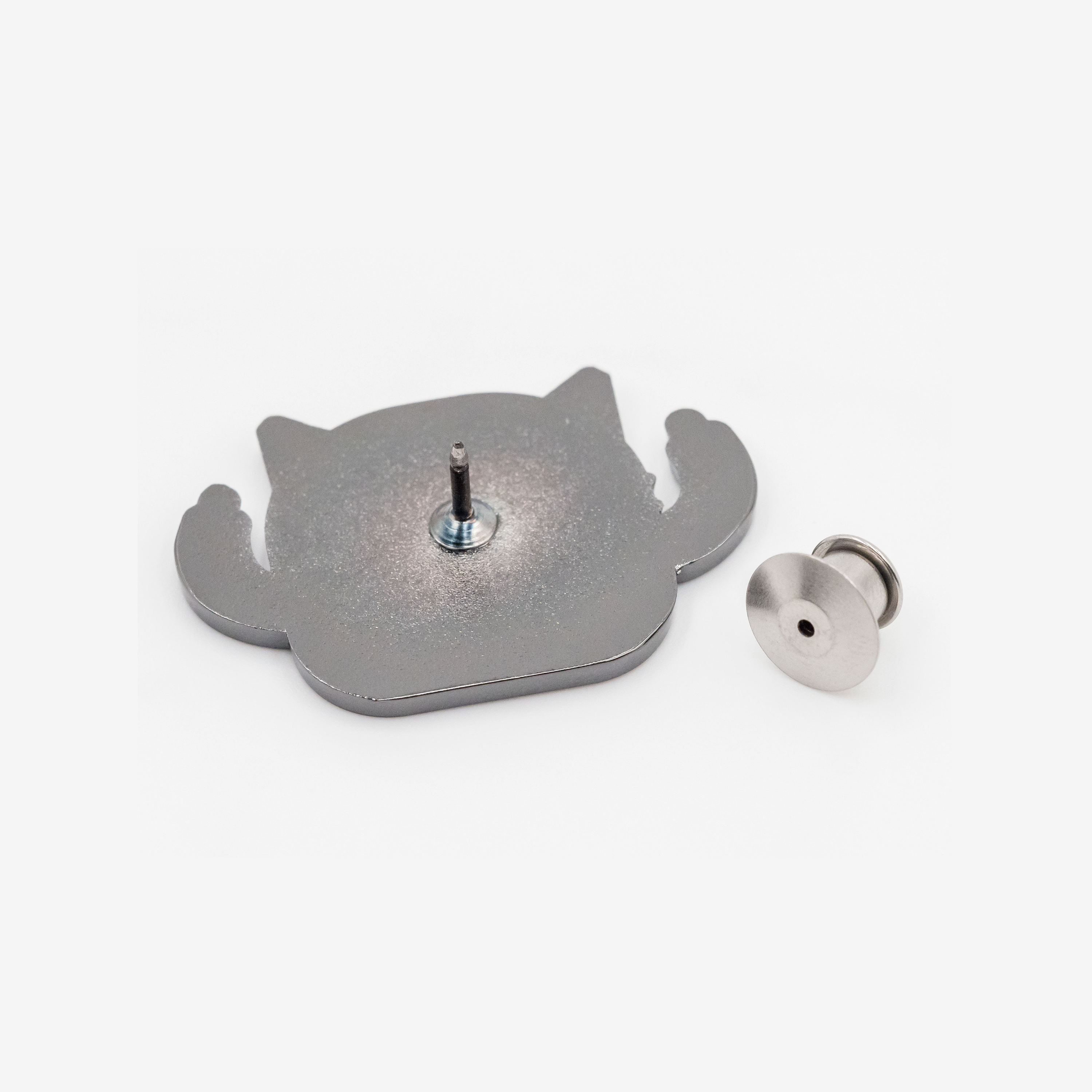Cat enamel pin and pin back, rear view, metallic silver on white background