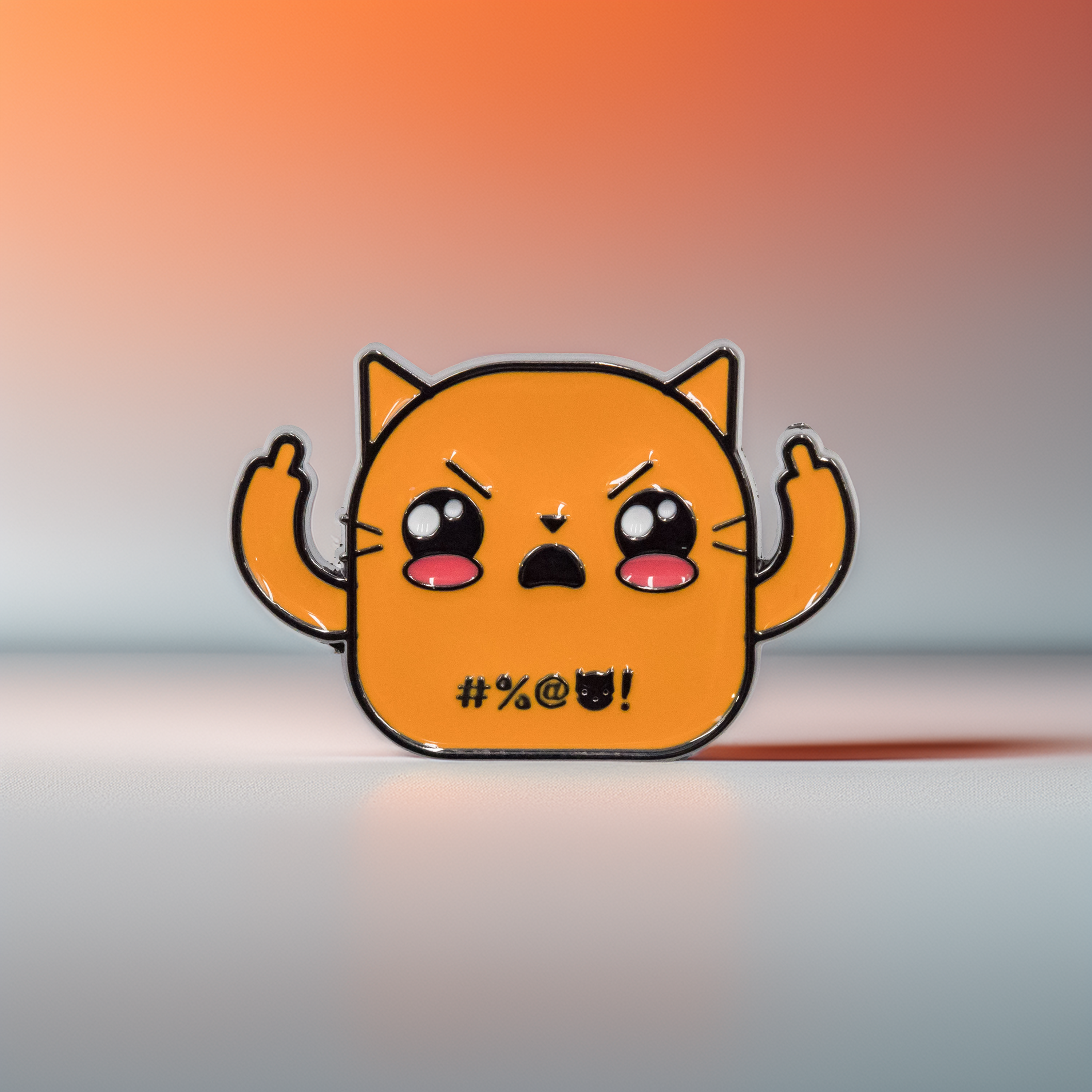 Orange cat enamel pin with middle fingers up, front view