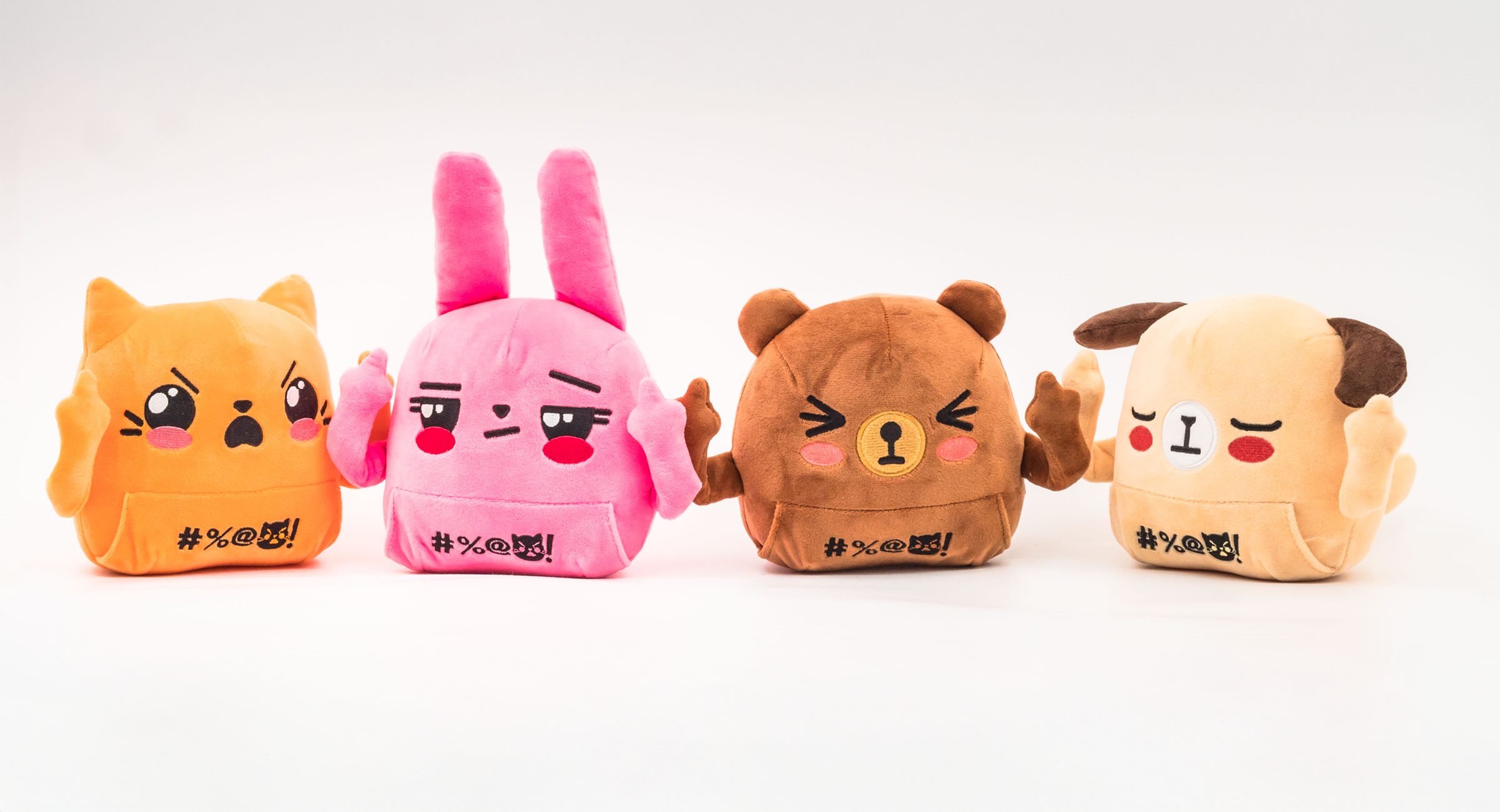 Orange cat plush, pink bunny plush, brown bear plush, and beige dog plush standing together with middle fingers up.